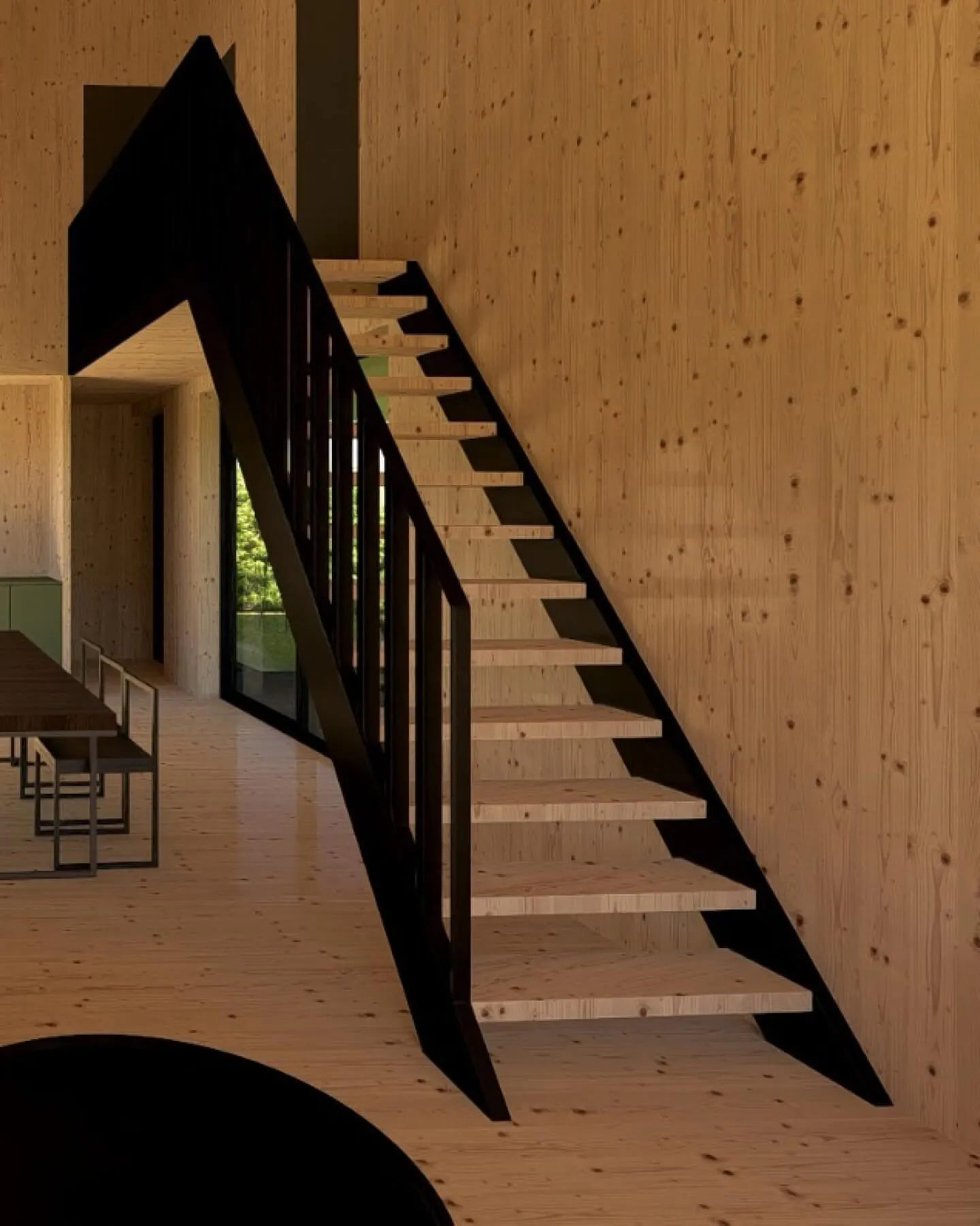 Black steel staircase in timber-lined hall