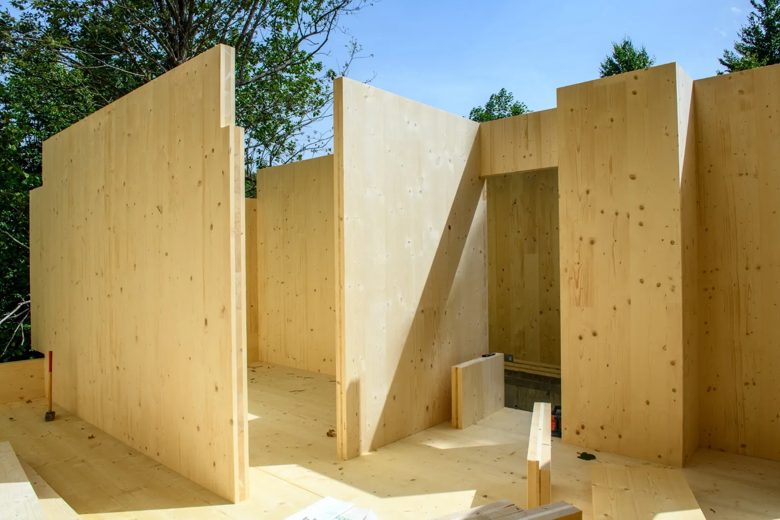 Cross-laminated timber panels of Monte Cora Grand House among the forest in Fužine